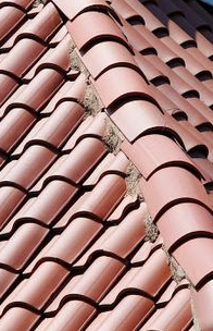 Here is the tile roof ridgeline that was made by some other Phoenix roofing company. Notice that the alignment is off. Not only do the roof tiles look bad, but with central Arizona's summer storms (the monsoons and the dusty haboobs), those poorly aligned tiles are more likely to crack. If the roof tile cracks and waters leaks under the roof, then water can damage the ceiling or attic below.